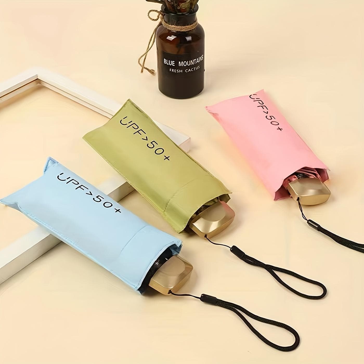 1 Stück kleiner Taschenschirm, Reiseschirm, kompakter, leichter tragbarer Schirm, UV-beständiger, wasserdichter, tragbarer Taschen-Reiseschirm für