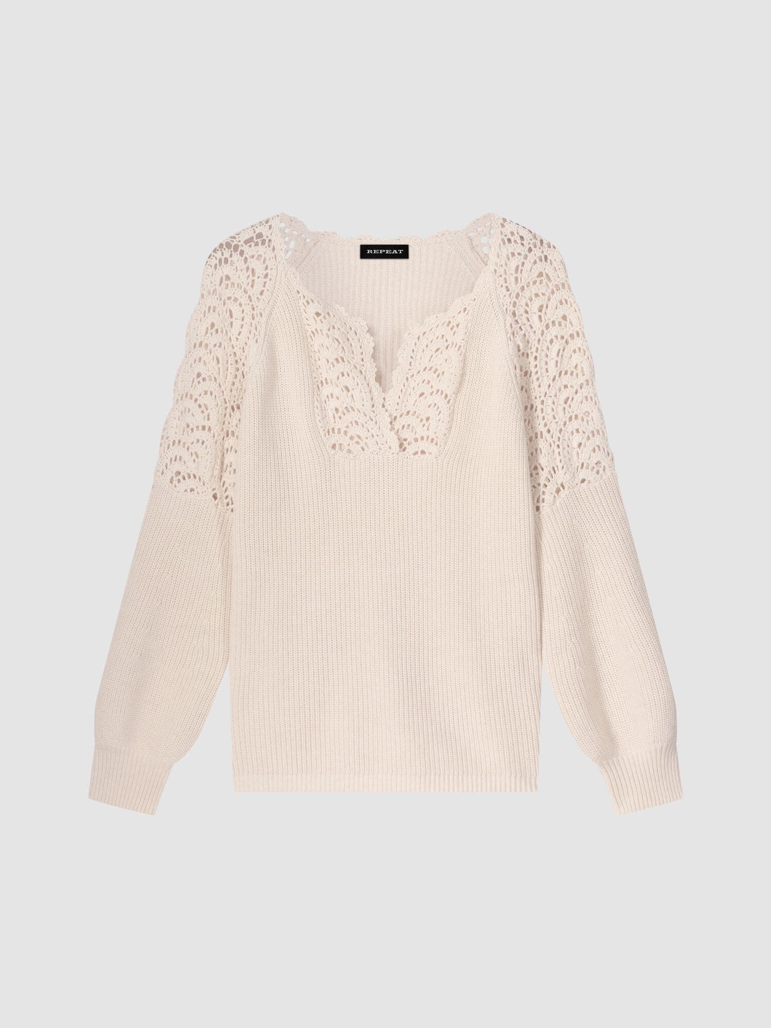 Pull en coton à manches bouffantes avec détails en crochet